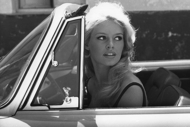 Brigitte Bardot in a classic car